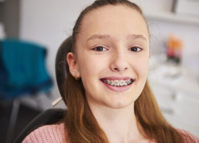 Portrait of smiling child with braces in dentist's office